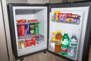 an open refrigerator filled with drinks and drinks at Leonardo Da Vinci Guest House in Rome