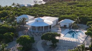 an aerial view of a house with a swimming pool at Kalopsia Seaside Villas & Marina in Great Guana Cay