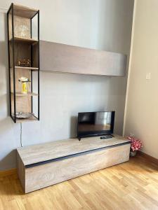 a living room with a flat screen tv on a table at CASA ARUCI in Avola