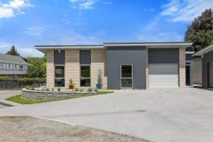 a house with a garage at All Good in Rotorua