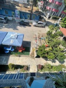 an aerial view of a playground with a blue building at Seliano Residence in Velipojë