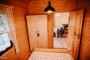 Postel nebo postele na pokoji v ubytování Domki w Zieleni