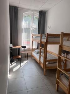 Postel nebo postele na pokoji v ubytování Golden Hostel