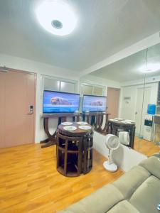 a living room with a couch and a table at MD Suite by Seawind in Davao City