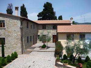 an external view of a building with a courtyard at Apartments in Barberino di Mugello 23852 in Montecarelli