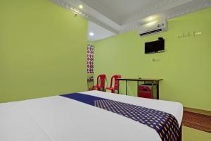 Ένα ή περισσότερα κρεβάτια σε δωμάτιο στο Hotel O SS Residency