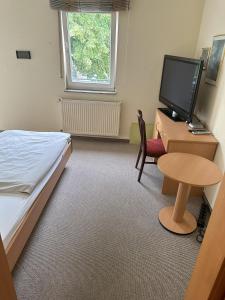 Postel nebo postele na pokoji v ubytování Aparthotel Zur Linde - by Willms & Schömer eG