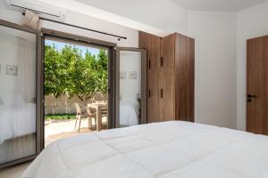 Ένα ή περισσότερα κρεβάτια σε δωμάτιο στο Casa Stefania