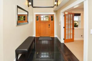 a hallway with a bench in front of a door at Nature's Gate Executive Estate in Victoria
