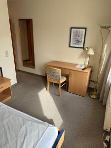 Postel nebo postele na pokoji v ubytování Aparthotel Zur Linde - by Willms & Schömer eG