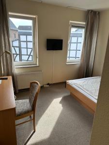 TV a/nebo společenská místnost v ubytování Aparthotel Zur Linde - by Willms & Schömer eG