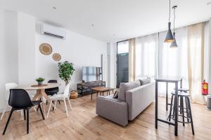 a living room with a couch and a table at AB40 Home Design in Madrid