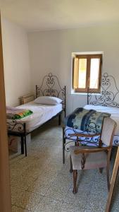 Ένα ή περισσότερα κρεβάτια σε δωμάτιο στο Casa vacanze montagna lucchese
