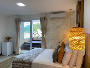 Postel nebo postele na pokoji v ubytování Charme Pousada Boutique & Spa