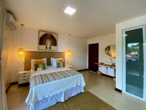 Postel nebo postele na pokoji v ubytování Charme Pousada Boutique & Spa