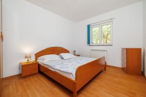 Postel nebo postele na pokoji v ubytování Apartments Krunoslav