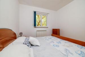 Postel nebo postele na pokoji v ubytování Apartments Krunoslav