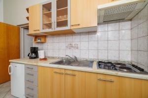 Kuchyň nebo kuchyňský kout v ubytování Apartments Krunoslav