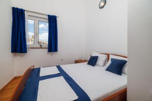 Postel nebo postele na pokoji v ubytování Apartments Krunoslav