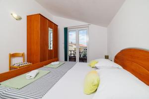 Postel nebo postele na pokoji v ubytování Apartments Krunoslav