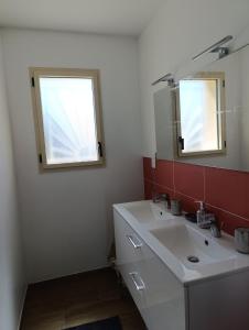 a bathroom with a sink and a mirror at Maison 3 chambres avec jardin calme et Nature in Nontron