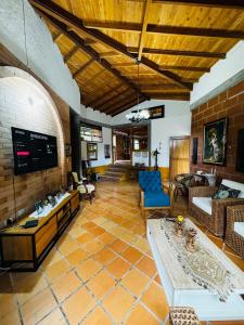 a living room with a couch and a table at Magical farmhouse near Arví Park in Mazo +48 photos