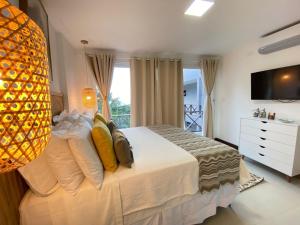 TV a/nebo společenská místnost v ubytování Charme Pousada Boutique & Spa