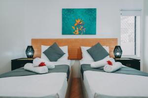 Postel nebo postele na pokoji v ubytování Moana Sands Beachfront Villas + 37 fotografií