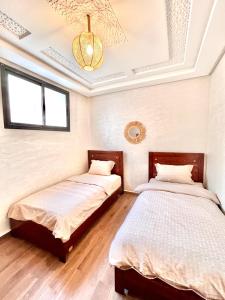 En eller flere senge i et værelse på Dar Itran Sunny Apartment near Taghazout