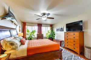 a bedroom with a bed and a ceiling fan at Soldotna Home with Yard, Walk to Kenai River! in Soldotna