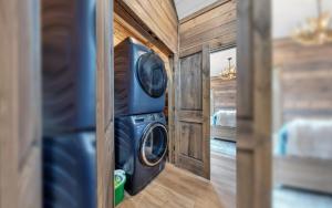 a washer and dryer in a tiny house at Hang Yer Hat in Sevierville