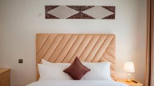 Ένα ή περισσότερα κρεβάτια σε δωμάτιο στο AHACU Residence Kigali - Rwanda +15 φωτογραφίες