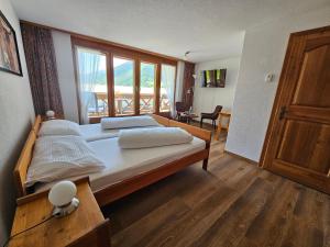 Postel nebo postele na pokoji v ubytování Lärchen Lodge