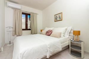 Katil atau katil-katil dalam bilik di Apartments Golden Beach