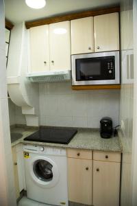 Kuchyňa alebo kuchynka v ubytovaní Xavestre Rooms Santiago