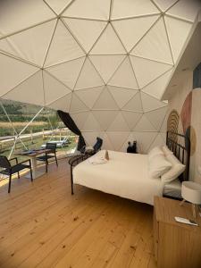 Postel nebo postele na pokoji v ubytování Glamping Monte Velino + 37 fotografií