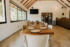 a large dining room with a long table and chairs at Villa Jelica in Konjic