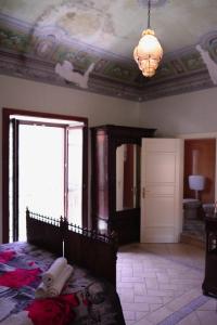 Ένα ή περισσότερα κρεβάτια σε δωμάτιο στο Casa Tramontana Ospitalità Diffusa
