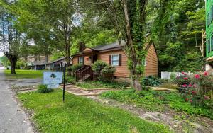 a house with a sign in front of it at Skinny Dipping in Gatlinburg