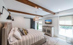 a bedroom with a bed and a fireplace at Farmhouse in the Burg in Gatlinburg