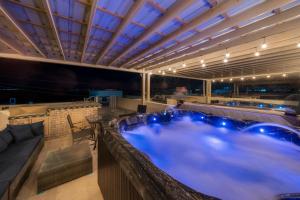 a bar with a hot tub in a room at 3 Story Home 3BR 2BA with Rooftop View and Heated Pool in La Choya