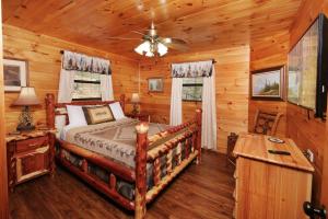 a bedroom with a bed in a log cabin at Amazing Grace in Sevierville