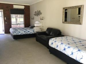 Voodi või voodid majutusasutuse Fairway Views Motor Inn toas