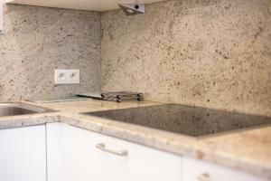 a kitchen with a sink and a counter top at Plaza 305-Gv03 in Sint-Idesbald +14 photos