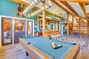 a room with a pool table in a house at Red Hawk Ridge SD Mag Design Winner in Alpine