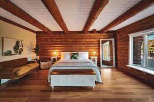 a bedroom with a bed and a couch at Red Hawk Ridge SD Mag Design Winner in Alpine