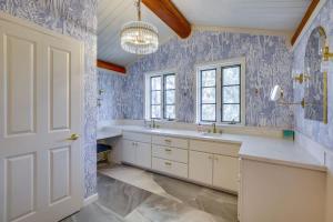 a bathroom with a large sink and a chandelier at Japatul House w Pool & Spa 5 Star Google Reviews in Alpine
