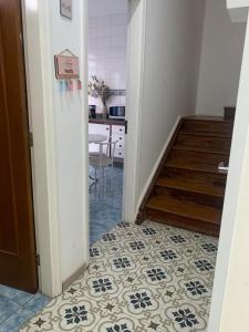 a hallway with a tile floor and stairs in a house at Hostel Jm 2 in Itu +27 photos