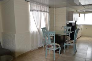 a kitchen with a table and chairs in a room at Casa Hotel Descanso Quindiano in Montenegro +26 photos