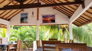 a dining room with a table and chairs at Serah's Homestay in Kuta Lombok